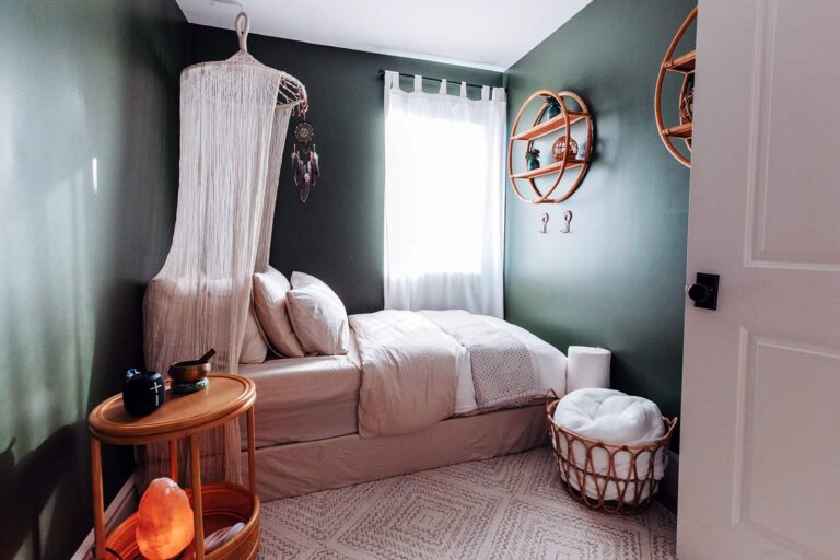 Serene therapy bedroom with canopy bed and Himalayan salt lamp